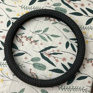 Black Fabric steering wheel cover with silver glittery dots.